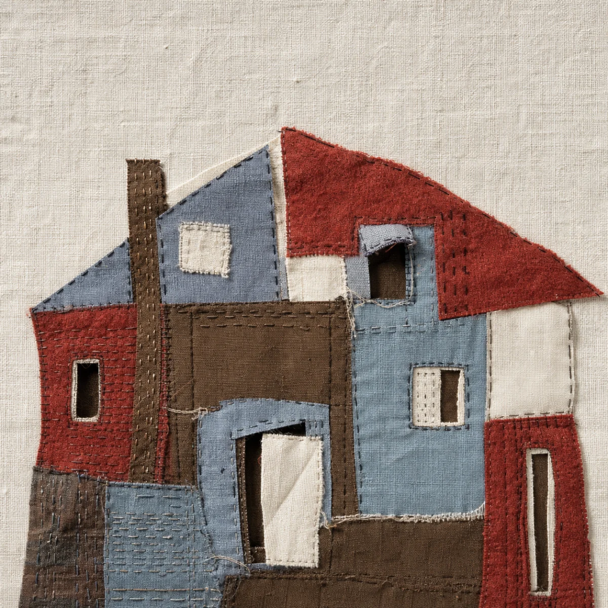 Patchwork abstract house assembled from different fabrics and shapes
