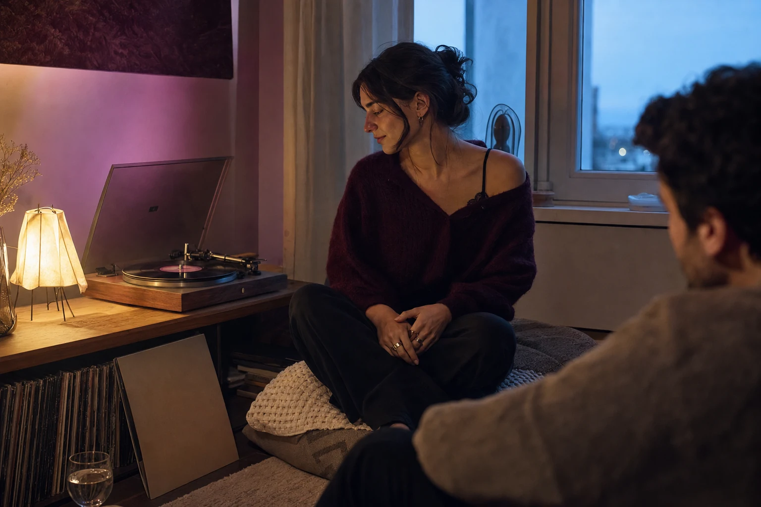 Girlfriend hearing a personalized song beside a record player in a private room