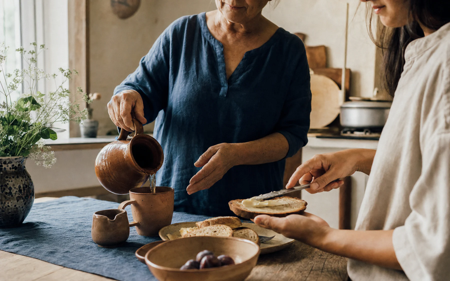 Fine-art documentary scene of a mother’s hands in warm morning light