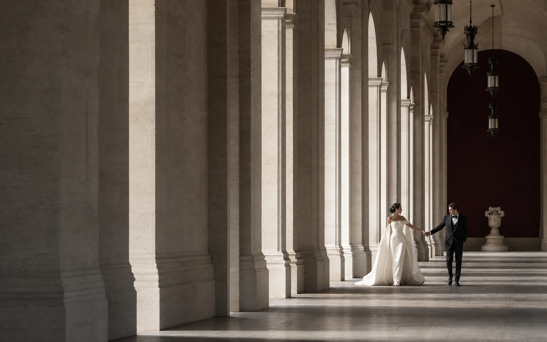 High-fashion architectural wedding scene in pearl, burgundy, and graphite tones