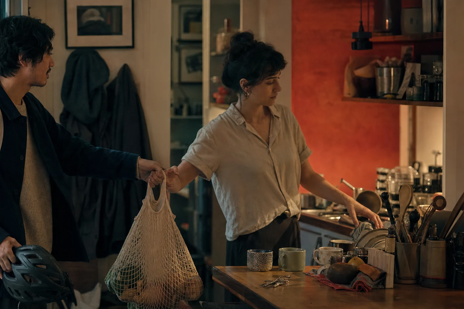 Contemporary cinematic still of two partners coordinating an ordinary day in deep teal and coral