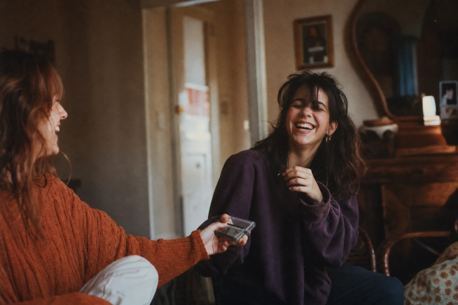 1990s family-film scene of sisters in violet, orange, cream, and a small blue-green accent